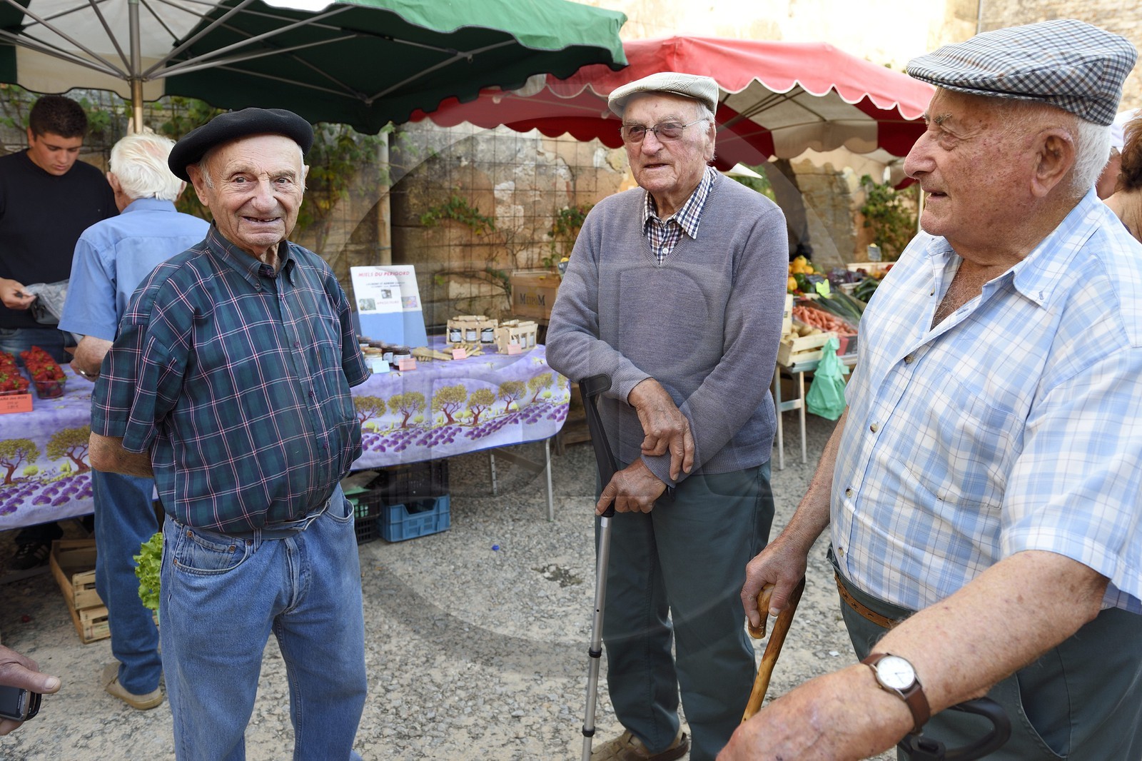 France, Dordogne, Perigord Pourpre, Monpazier, labelled Les Plus Beaux Villages de France (The Most Beautiful Villages in France), market day on the place des Cornieres, a trio of village elders