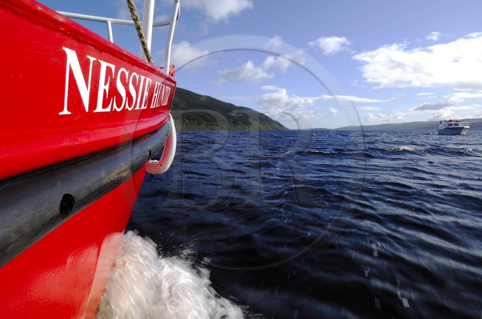 United Kingdom, Scotland, Highlands, Loch Ness, the boat Nessie Hunter sailing towards Urquhart castle