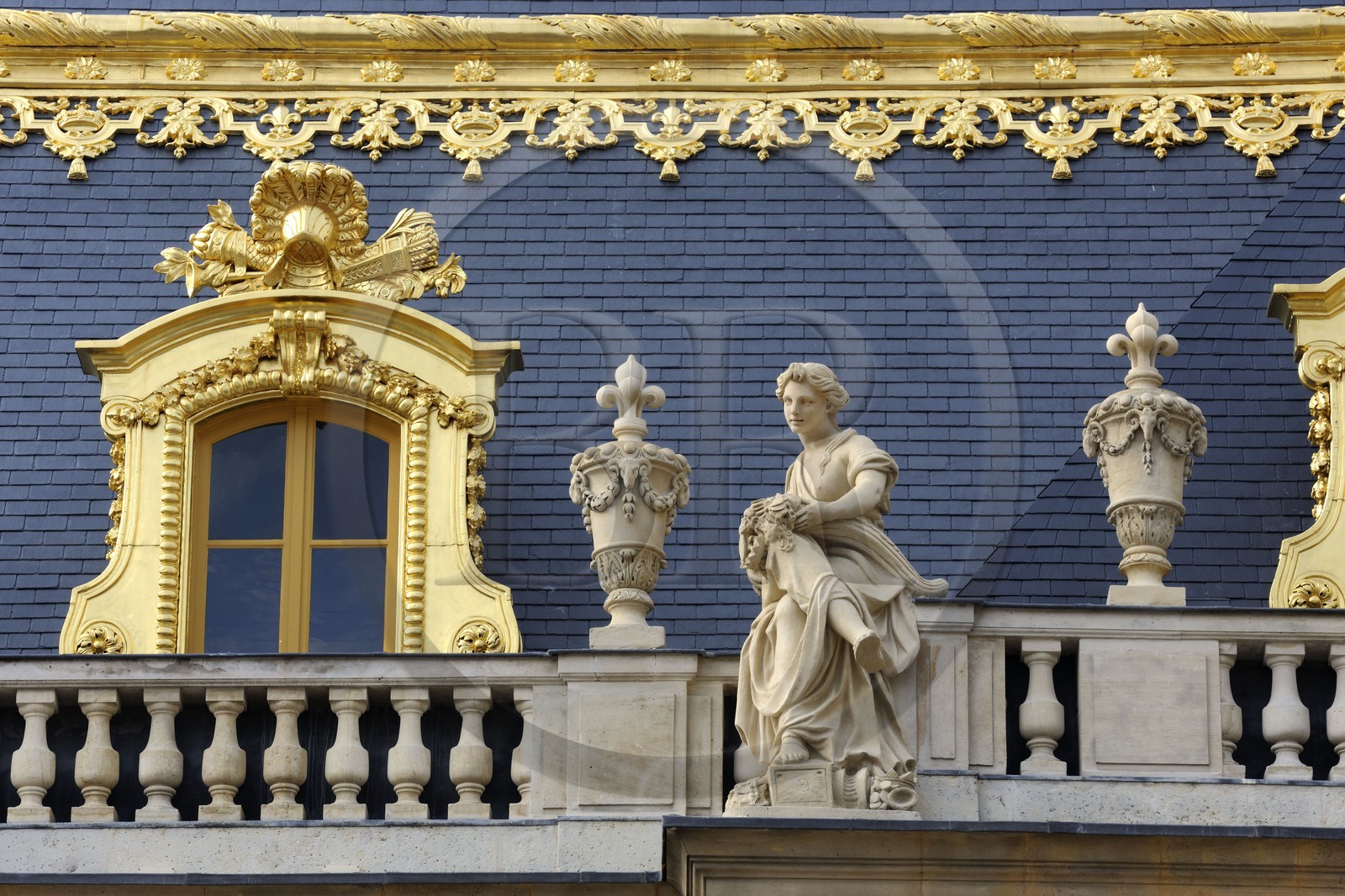 France, Yvelines, Chateau de Versailles, listed as World Heritage by UNESCO, statue on the roof of a building from the Cour de Marbre (Marble Courtyard) renovated in 2008