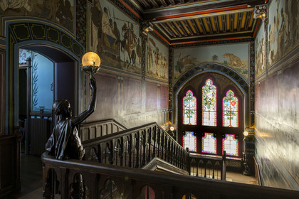France, Pyrenees Atlantiques, Basque Country coast, Hendaye, Abbadia castle built in 1870 by Eugène Viollet-le-Duc for Antoine d'Abbadie d'Arrast, the grand staircase, torchiere lamp statue representing Abdullah former Ethiopian slave freed and dead under the commune of Paris