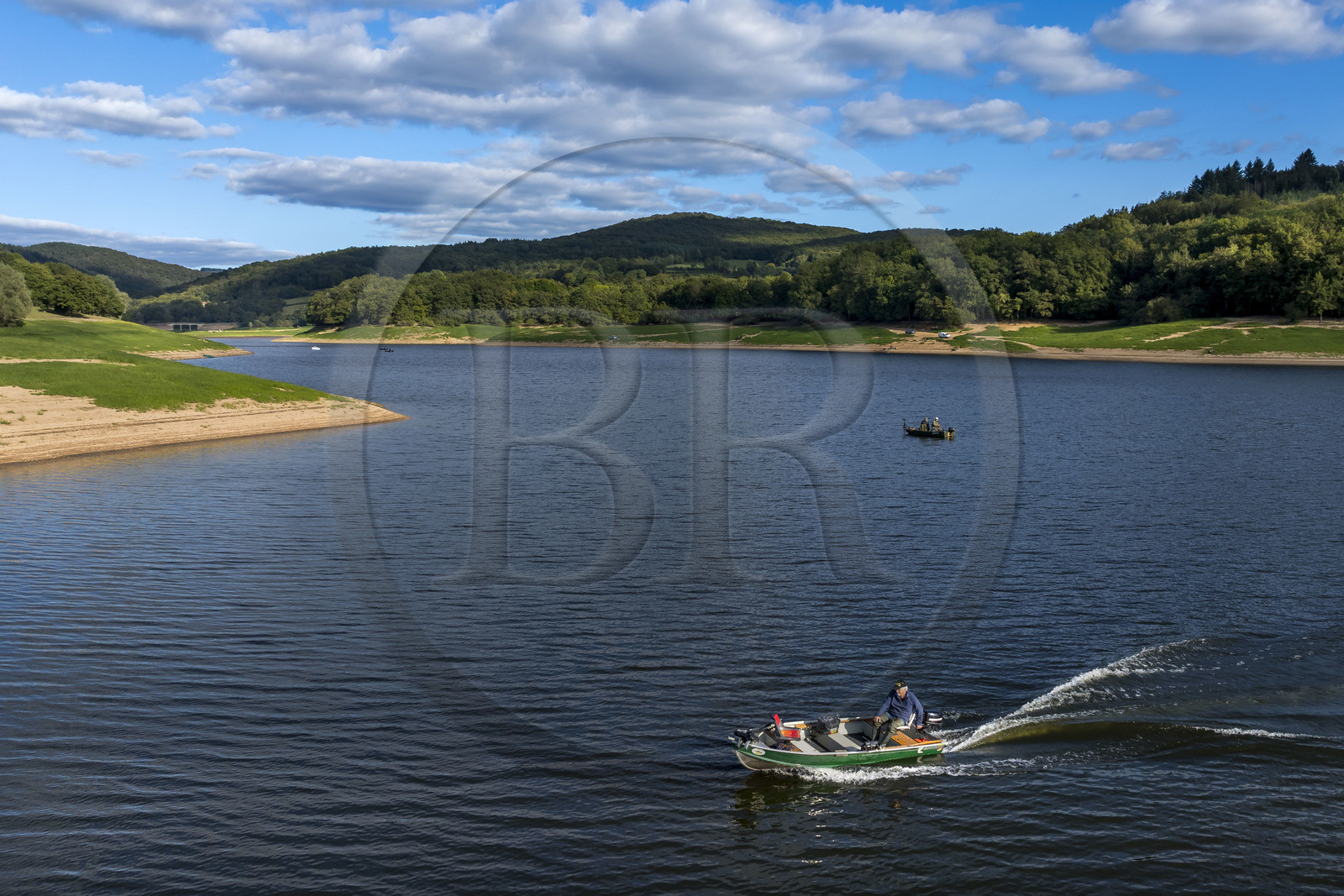 France, Nievre, Regional Natural Park of Morvan, Chaumard, Pannecière lake, Jean-Bernard Dioux, vice-president of the AMC, the Morvan Carnassier Association, goes fishing on a boat (aerial view)