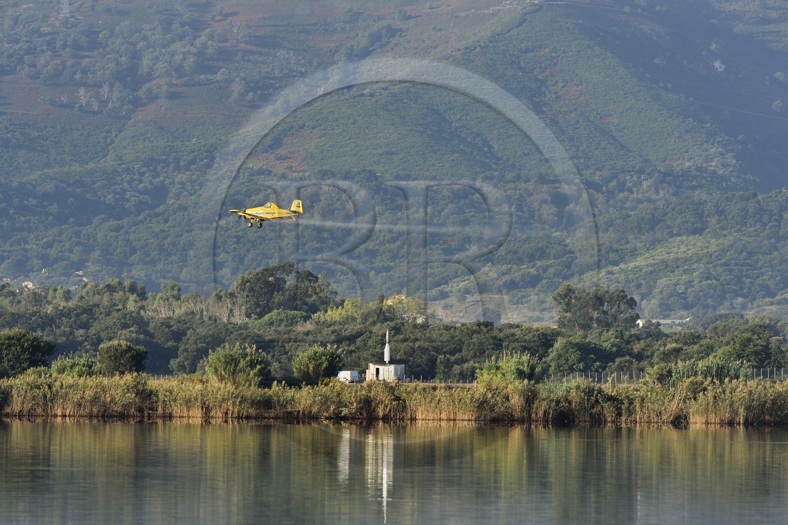 France, Haute Corse, the pond of Biguglia (Stagnu di Chiurlinu), nature reserve of Corsica (RNC), spraying of mosquito repellents