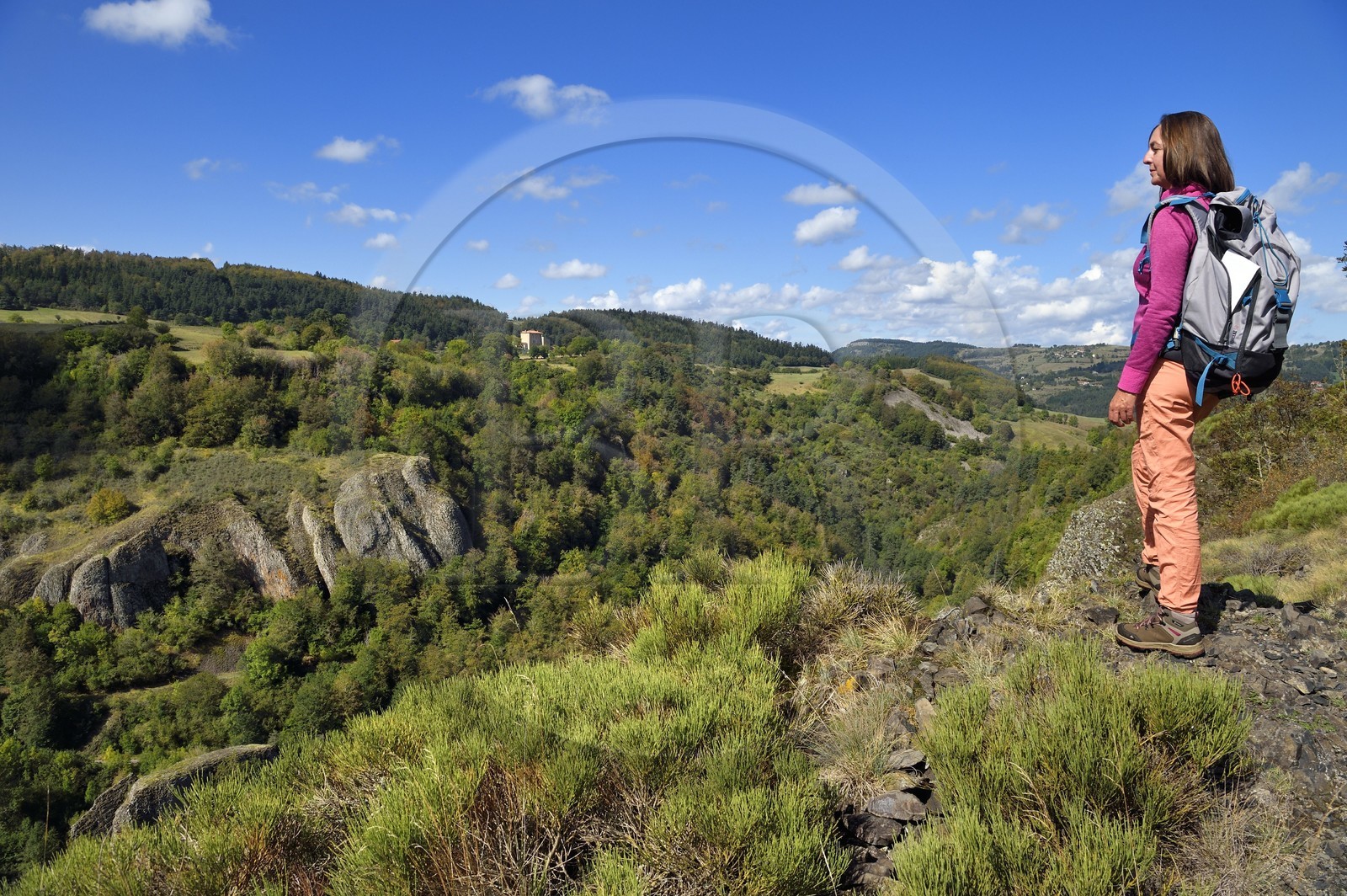 France, Haute Loire, Loire river Valley, Lafarre, hiker observing the stronghold of Cros de Lafarre above the gorges of La Langougniole, tributary of the Loire