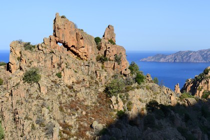 France, Corse du Sud, Golfe de Porto, listed as World Heritage by UNESCO, the Creeks of Piana (Calanches de Piana) with pink granite rocks and the Scandola peninsula Nature Reserve in the background