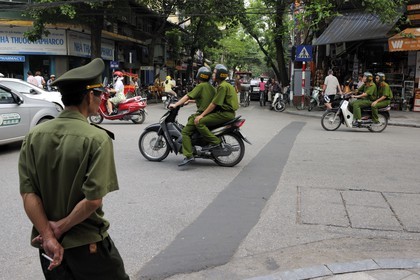 Vietnam, Hanoi, policemen on motorcycle in the old city