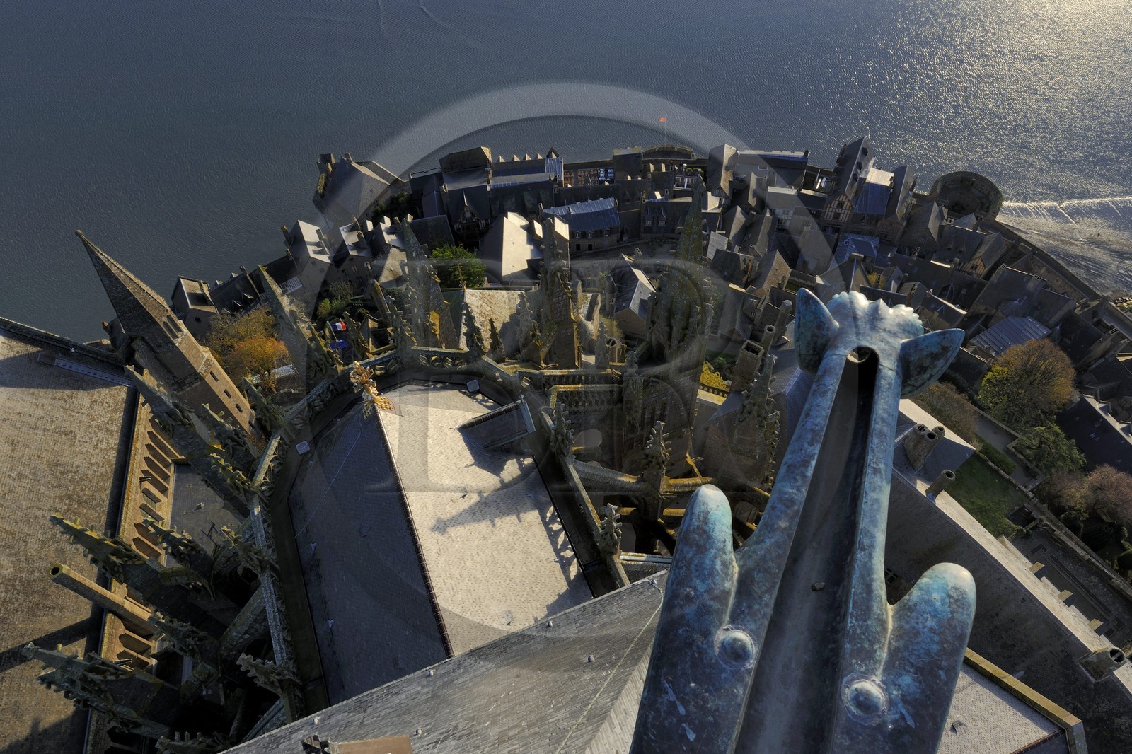 France, Manche, Mont Saint Michel, listed as World Heritage by UNESCO, the church and the village seen from the spire at dawn