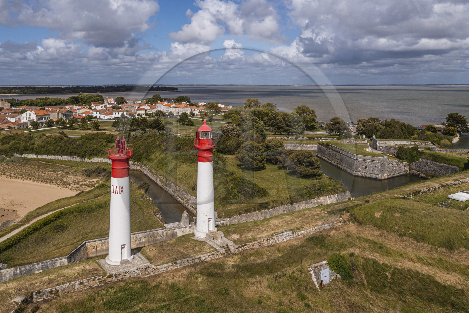 France, Charente-Maritime, Ile d'Aix (Aix Island), Fort de la Rade, lighthouse of the island with two towers built in 1840 and ditches of the fortifications then the village in the background (aerial view)