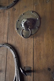 France, Haute Loire, Brioude, the Basilica of Saint-Julien de Brioude in Auvergne Romanesque style, south door 12th century bronze knocker which represents the facies of a mischievous monkey