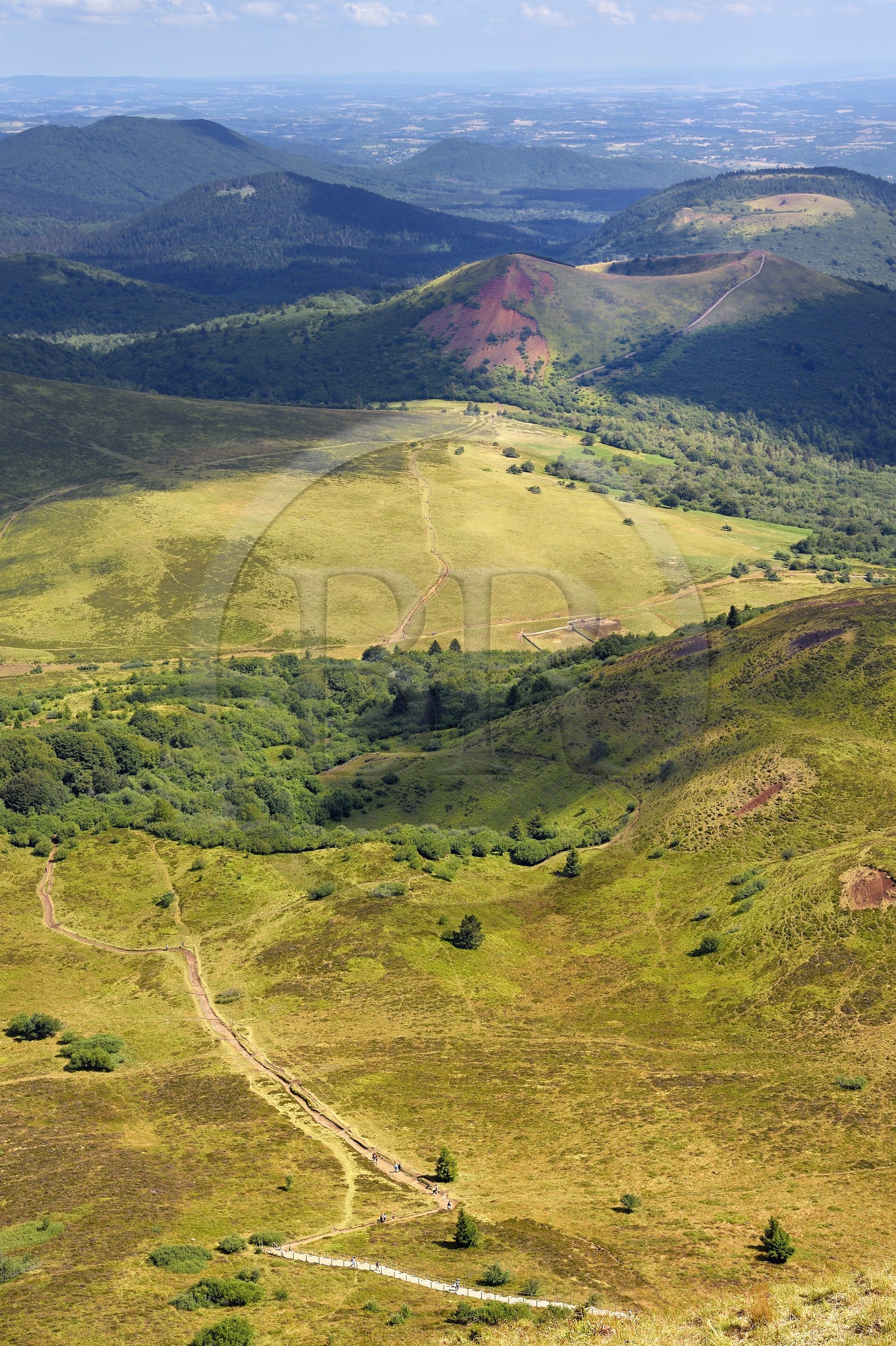 France, Puy de Dome, Parc Naturel Régional des Volcans d'Auvergne (regional nature park of Auvergne volcanoes), Chaine des Puys listed as World heritage by UNESCO, the path leading to the Traversin and the Puy Pariou crater