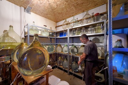 France, Reunion island (French overseas department), La Saline, La Part des Anges Distillation, reserve and aging of eaux-de-vie in glass jars, sampling for alcohol weighing