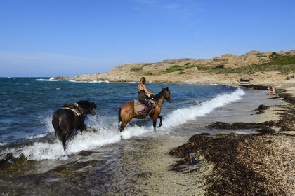 France, Haute Corse, Nebbio, Agriates Desert, Peraiola Cove, rider on Ostriconi beach