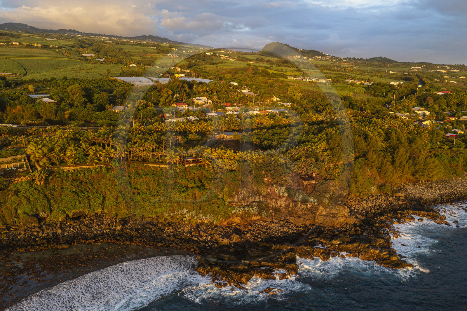 France, Reunion island (French overseas department), Petite-Ile on the southern coast, beach, rocks and sugar cane fields (aerial view)