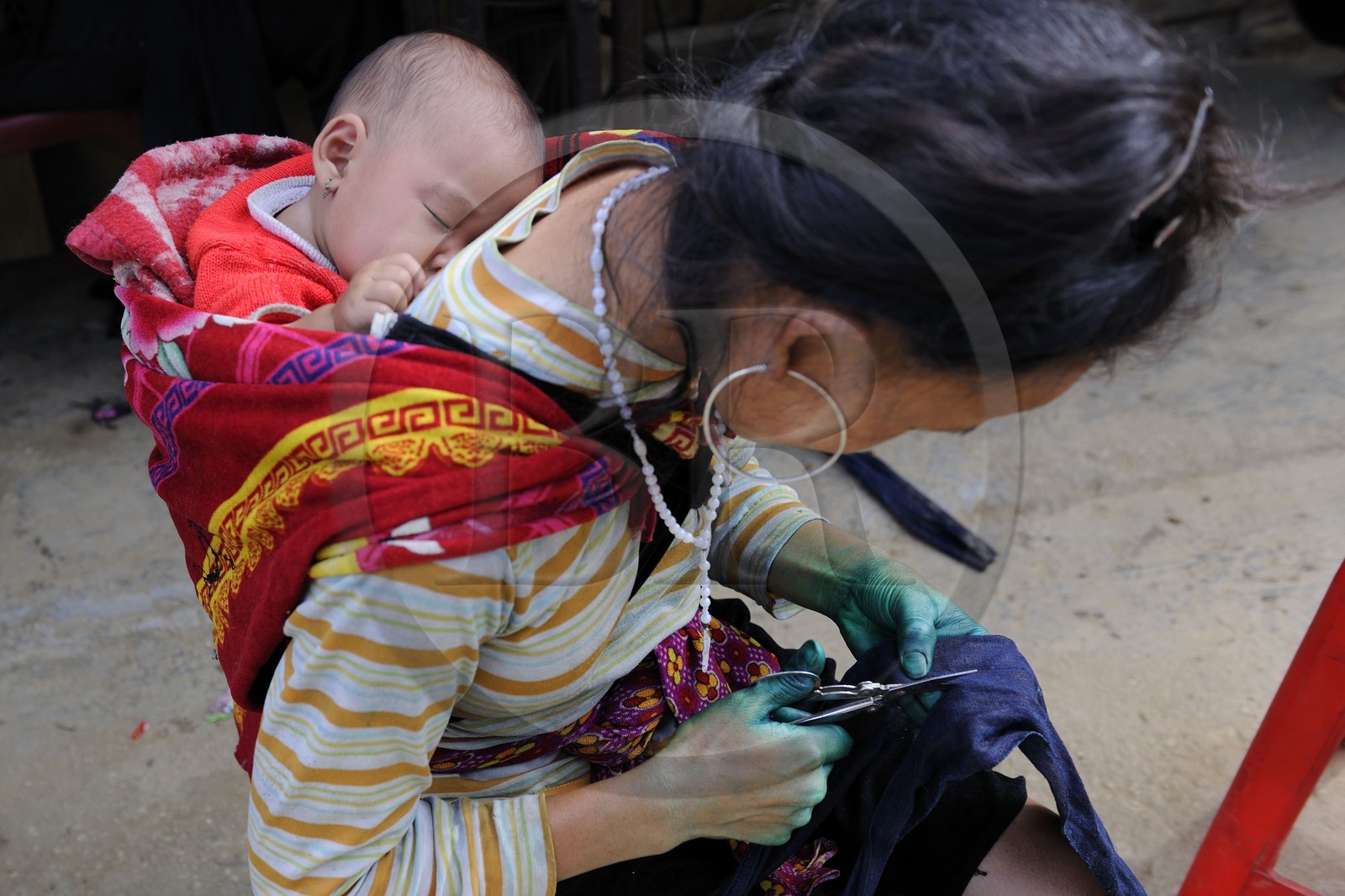 Vietnam, Lao Cai province, Sapa district, the Black Hmong minority group, sewing and blue indigo dyeing work