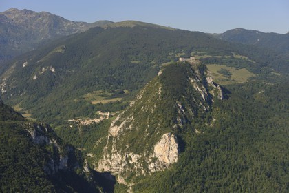 France, Ariege, Pays d' Olmes, Cathar Castle of Montsegur perched on a rock and the Pyrenees (aerial view)..