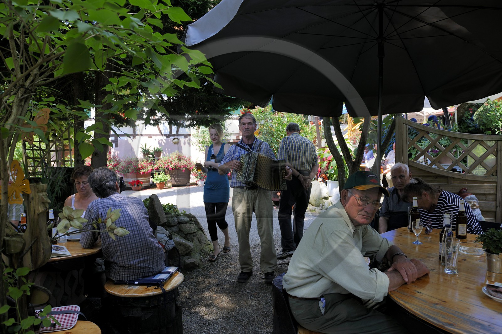 Germany, Black Forest, Schwarzwald, Baden-Württemberg, Ottenhoffen Region, Benz-Mühle Inn, an accordeonist plays and sings Lieder from the area