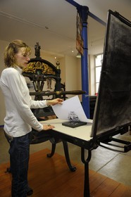 France, Vosges, Epinal, Cite de l'Image, Imagerie d'Epinal (Epinal Prints), wood engraving on a Gutenberg's press