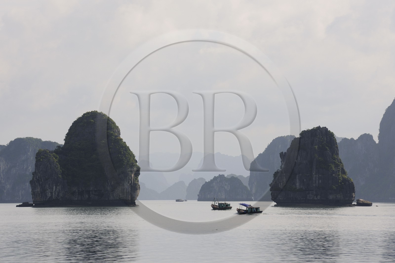 Vietnam, Quang Ninh Province, Halong Bay, listed as World Heritage by UNESCO, fishing boat