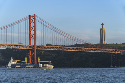 Portugal, Lisbon, 25 de Abril bridge on Tagus river and the Cristo Rei (Christ the King)