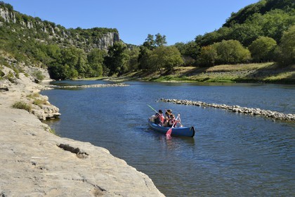 France, Ardeche, Balazuc, kayaks going down the Ardeche River between Balazuc and Pradons