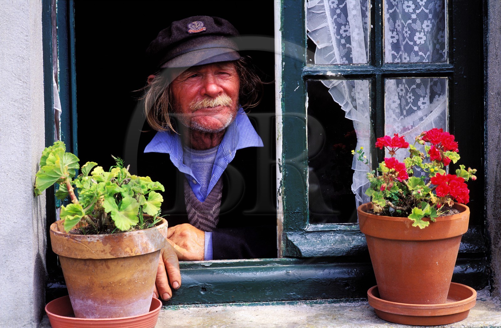 France, Manche, Iles Chausey, a former sailor by his window