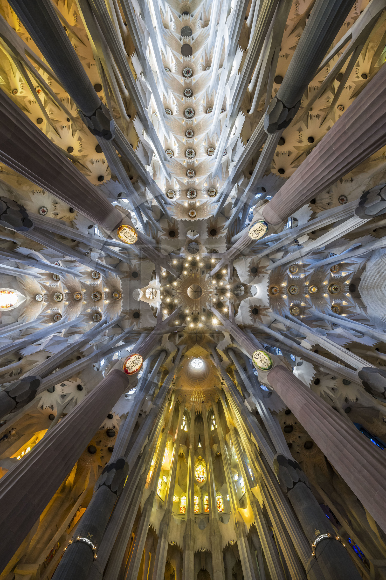 Spain, Catalonia, Barcelona, Eixample district, Sagrada Familia basilica by Catalan modernist architect Antoni Gaudi, listed as a UNESCO World Heritage Site, panoramic view from the vault at the nave and transept crossing which symbolizes the heavenly Jerusalem, the apse is at the bottom, the east on the right, the west on the left