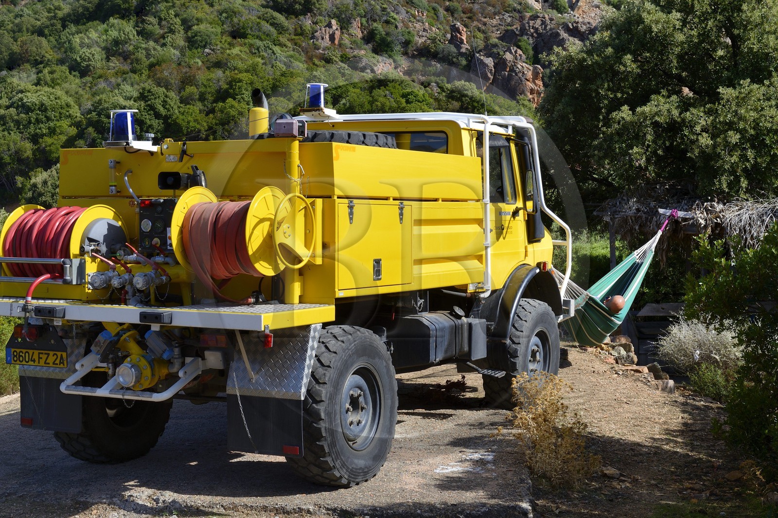 France, Corse du Sud, Golfe de Porto, listed as World Heritage by UNESCO, firefighters truck and nap in a hammock