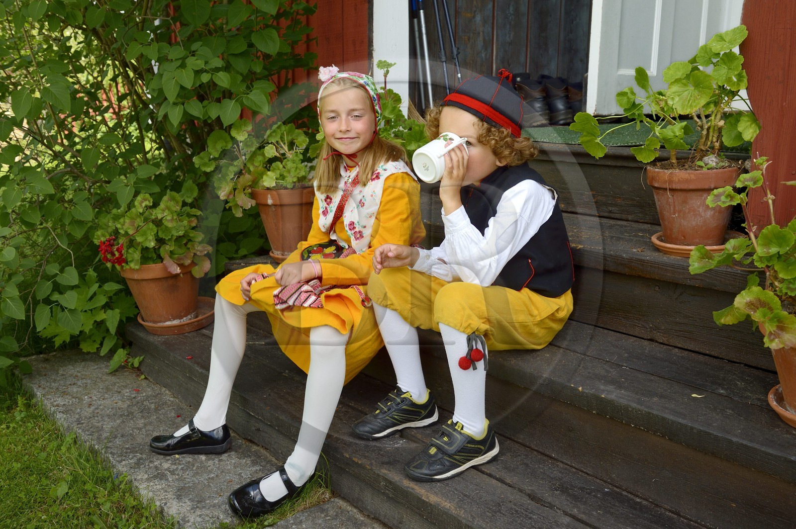 Sweden, Dalarna County, Leksand area, children in traditional costumes for the Midsummer celebrations in the tiny hamlet of Sunnanäng