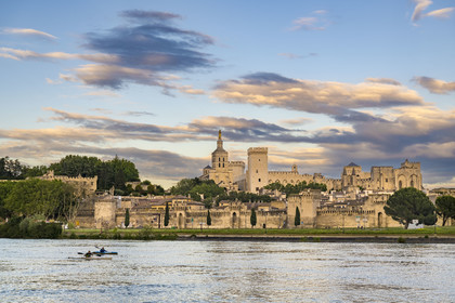 France, Vaucluse, Avignon, kayak passing on the Rhone in front of the Doms Cathedral and the Palais des Papes (Palace of the Popes) listed as World heritage by UNESCO
