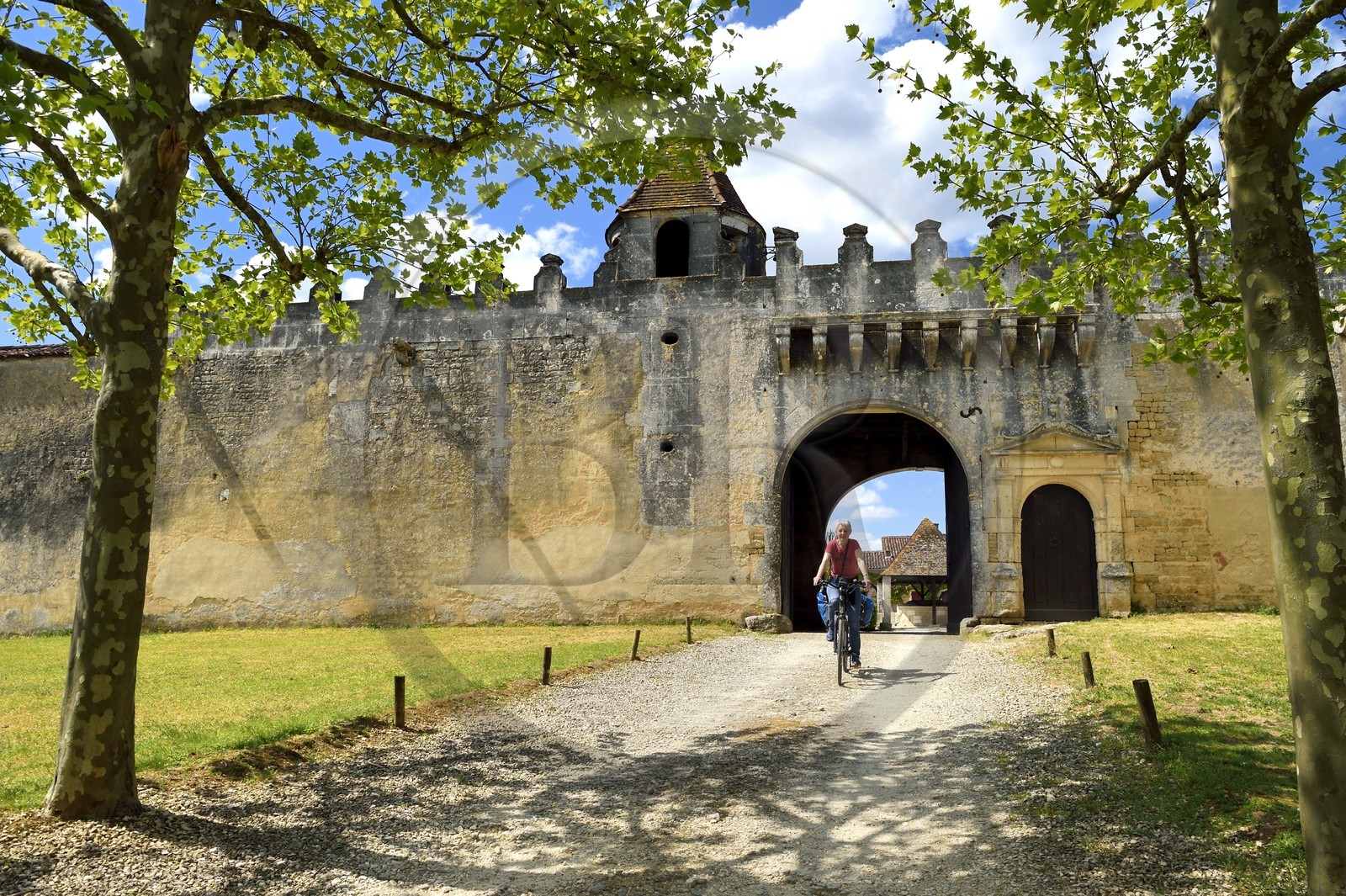 France, Charente, Saint-Brice, 16th century Logis de Garde-Epée, cyclists on the Flow Vélo cycle route