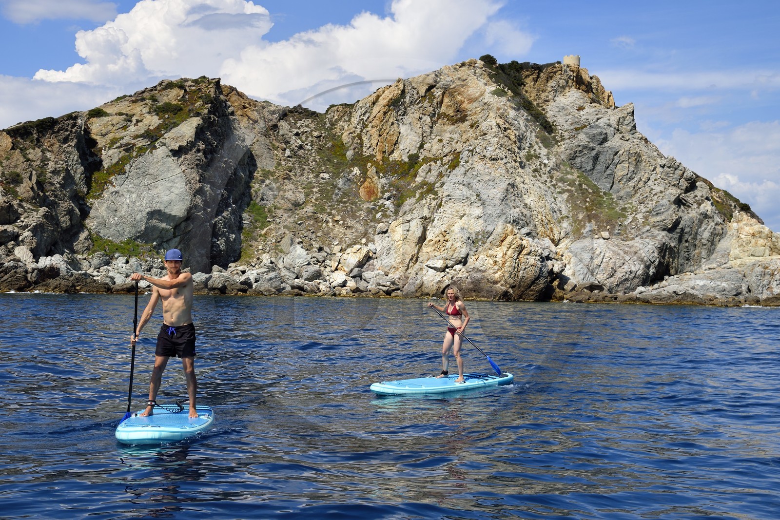 France, Var, Six Fours les Plages, Ile des Embiez, Pointe du Coucoussa overlooked by the Tour de la Marine, Freestyle windsurfing champion Adrien Bosson on a paddle boarding excursion