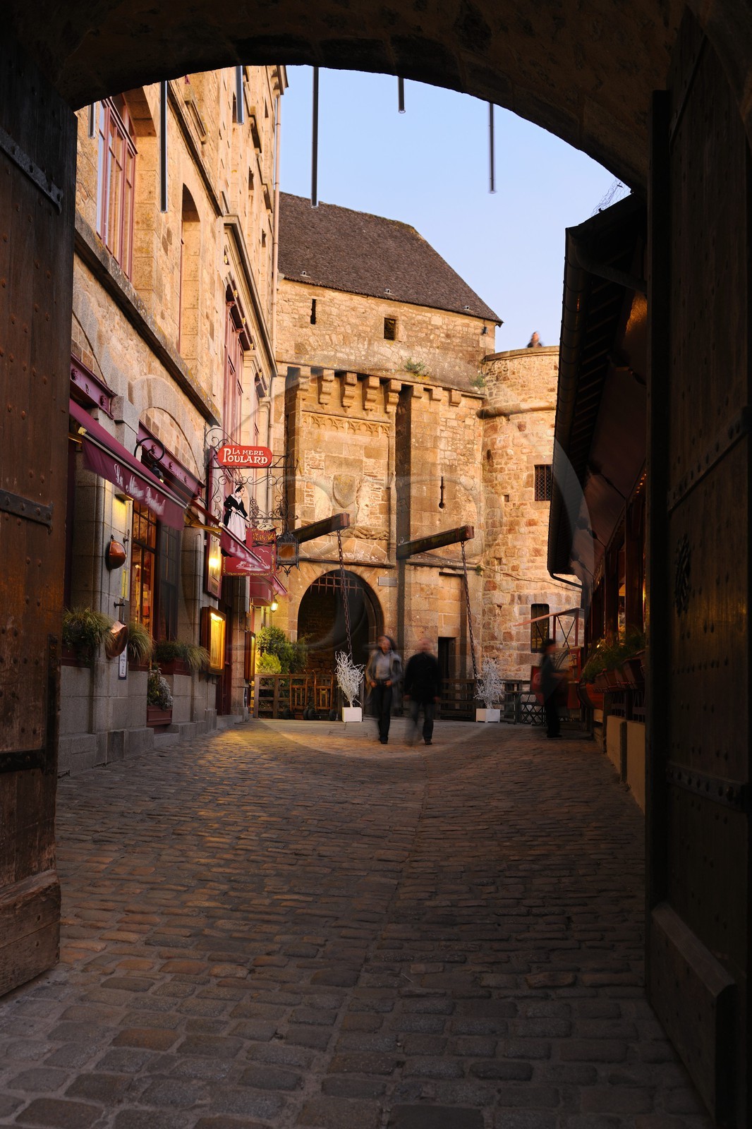 France, Manche, Mont Saint Michel, listed as World Heritage by UNESCO, the King Gate and the restaurant La Mère Poulard