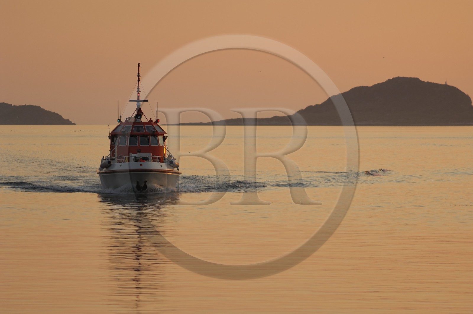 Norway, More Og Romsdal, boat entering Alesund's harbour at the midnight sun