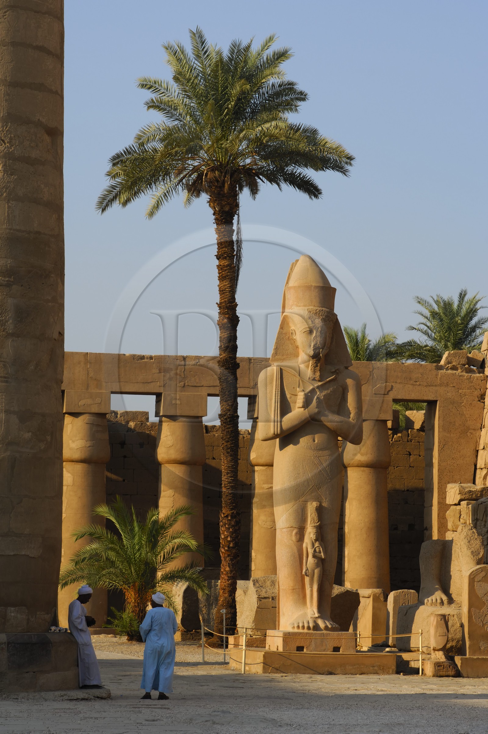 Egypt, Upper Egypt, Nile Valley, Luxor, Karnak Temple listed as World Heritage by UNESCO, the colossus of Ramesses II