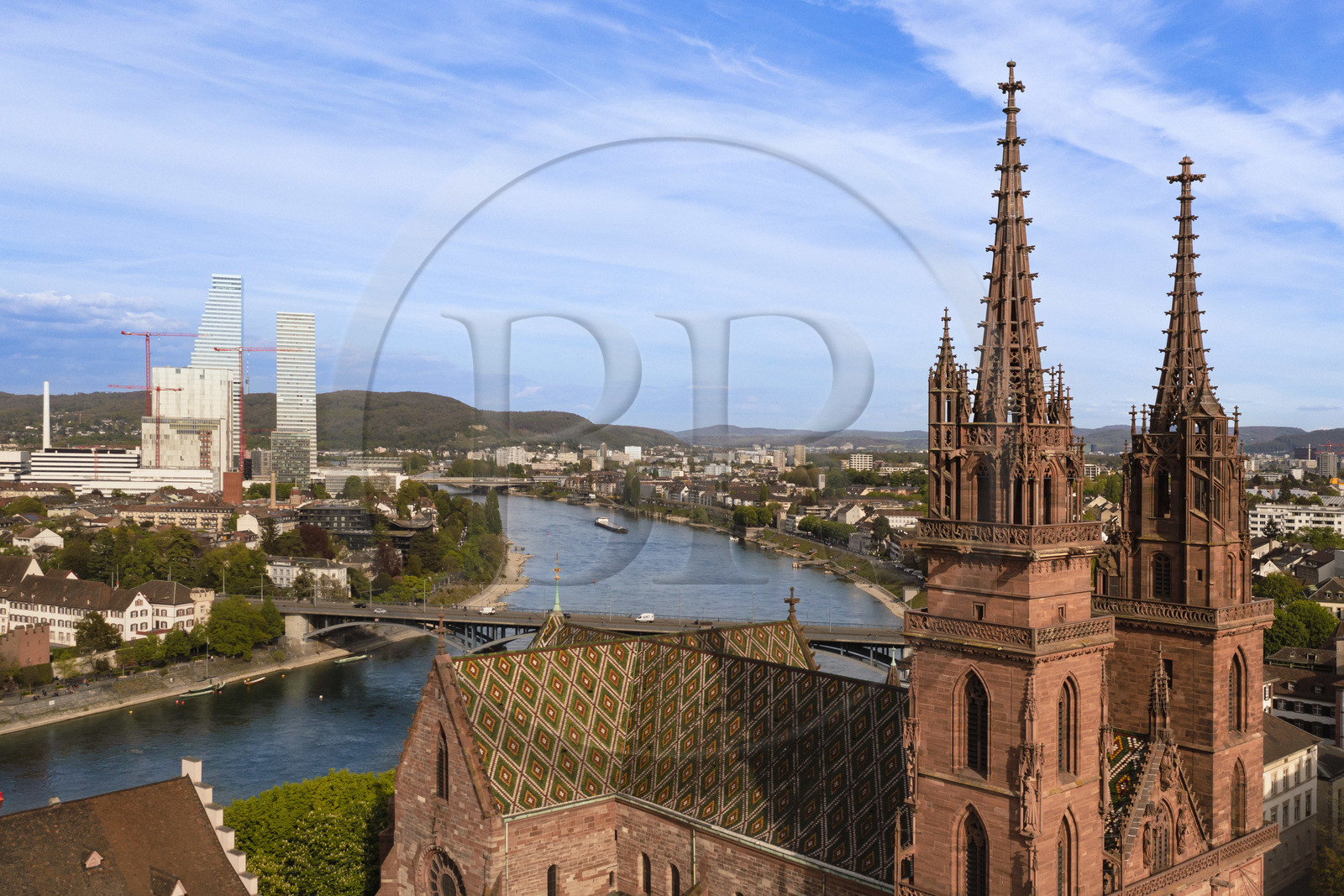 Switzerland, Basel, the left bank of the Rhine, the Minster or Protestant Cathedral of Our Lady of Basel (Munster) overlooking the Rhine, the Roche Towers in the background (aerial view)