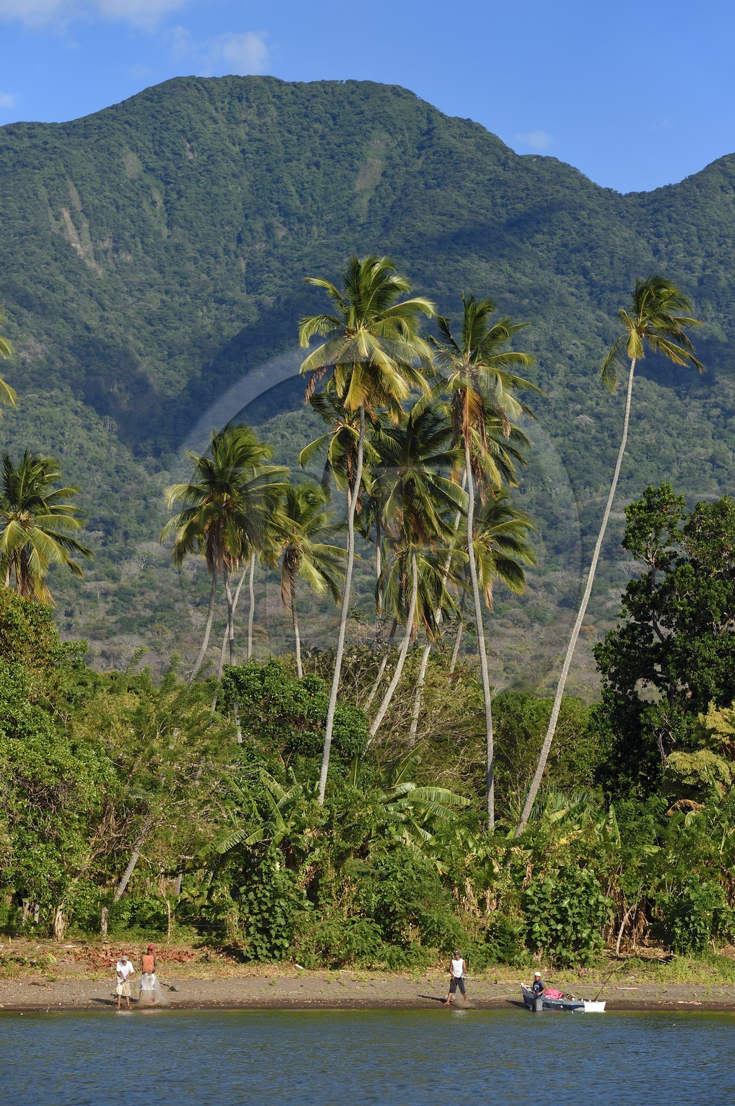 Nicaragua, Ometepe Island in Lake Nicaragua, village of Merida, fishermen on the beach and the Maderas volcano in the background
