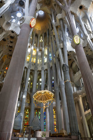 Spain, Catalonia, Barcelona, Eixample district, Sagrada Familia basilica by Catalan modernist architect Antoni Gaudi, listed as a UNESCO World Heritage Site, the presbyterium, a choir reserved for the clergy, surmounted by the crucified Christ hanging from a suspended canopy
