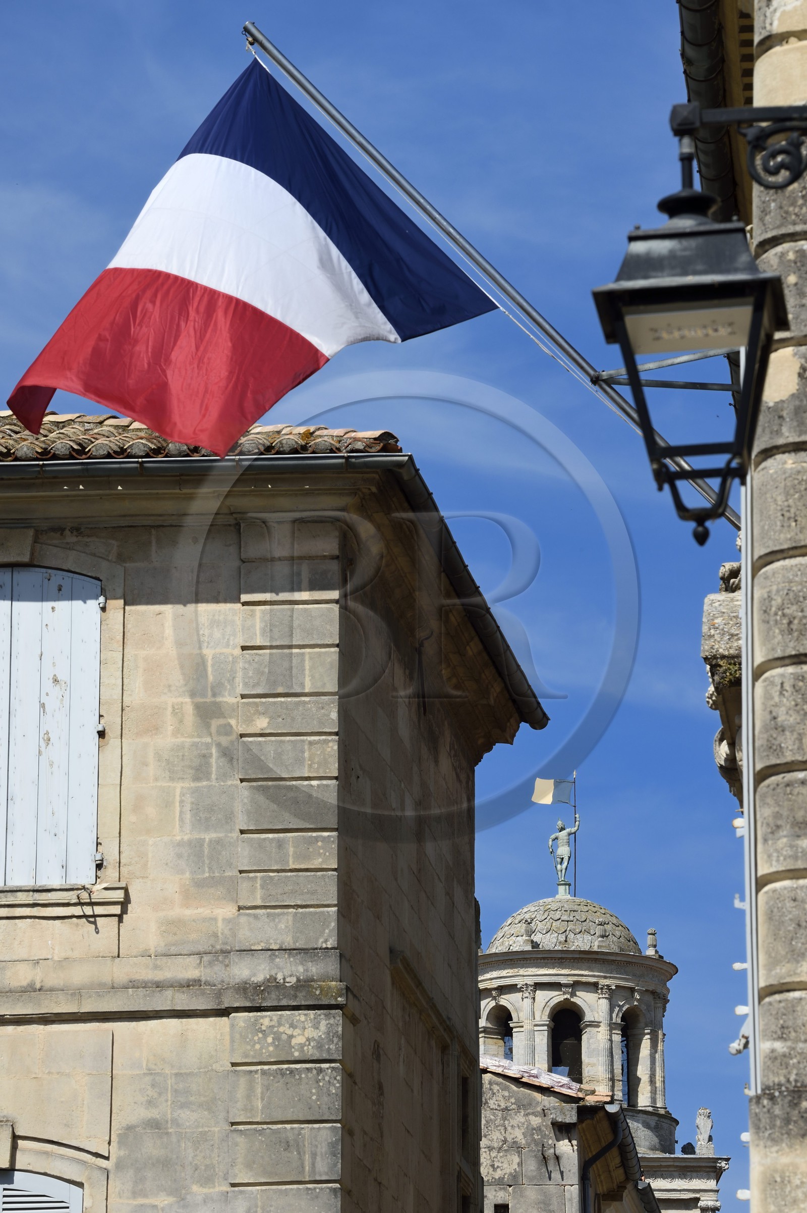 France, Bouches du Rhone, Arles, the clock tower of the town hall in the background