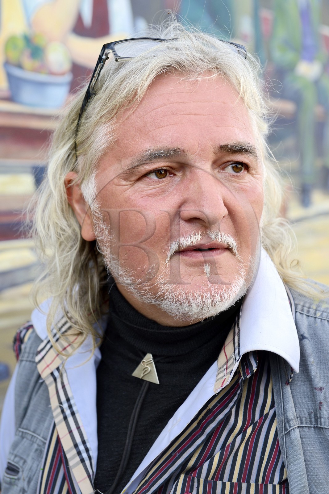 France, Moselle, Fensch Valley, the painter Greg Gawra Gawra in front one of his works on the wall of the Nilvange post office