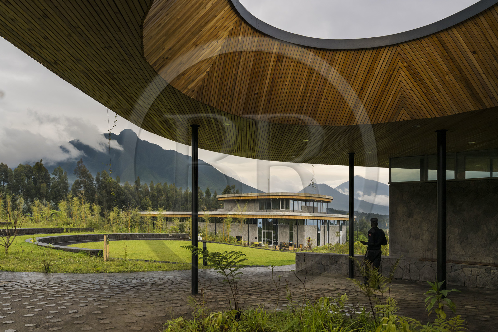 Rwanda, Northern Province, Musanze (Ruhengeri) District, Kinigi, Ellen DeGeneres Campus of the Dian Fossey Gorilla Fund by MASS Design Group architect, Cindy Broder Conservation Gallery with an immersive educational exhibit, Mount Sabyinyo and Mount Gahinga then Mount Muhavura (the three on the border with Uganda) in the background