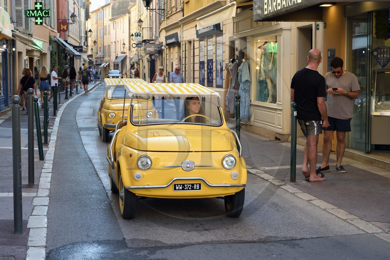 France, Var, Saint-Tropez, Fiat 500 advertising convertible arriving at the port from rue du general Allard