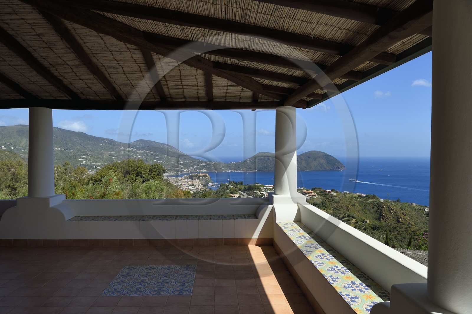 Italy, Sicily, Aeolian Islands, listed as World Heritage by UNESCO, Lipari Island, traditional house on the south-east coast, the citadel of Lipari in the background
