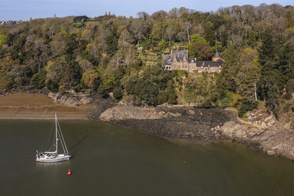 France, Côtes-d'Armor, Plouguiel, the Kestellic Botanical Garden, classified as a remarkable garden and its typically neo-Breton small manor overlooking the Jaudy river, sailboat from the Boreal shipyard (aerial view)
