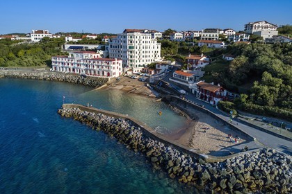 France, Pyrenees Atlantiques, Basque Country coast, Guethary, old whaling port overlooked by the former art deco Guétharia hotel built in the 1920s turned into a residence (aerial view)