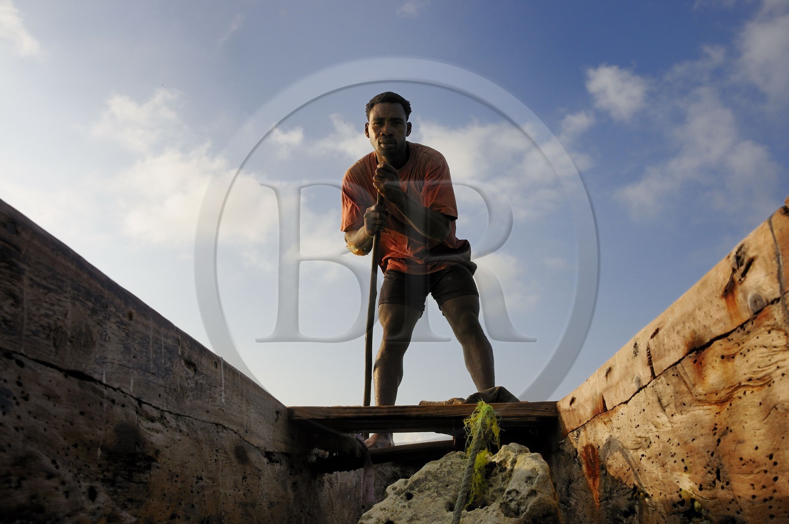 Tanzania, Zanzibar Archipelago, Unguja island (Zanzibar), southeast coast, Bwejuu, fisherman on a dhow (traditional Arab sailing vessel)