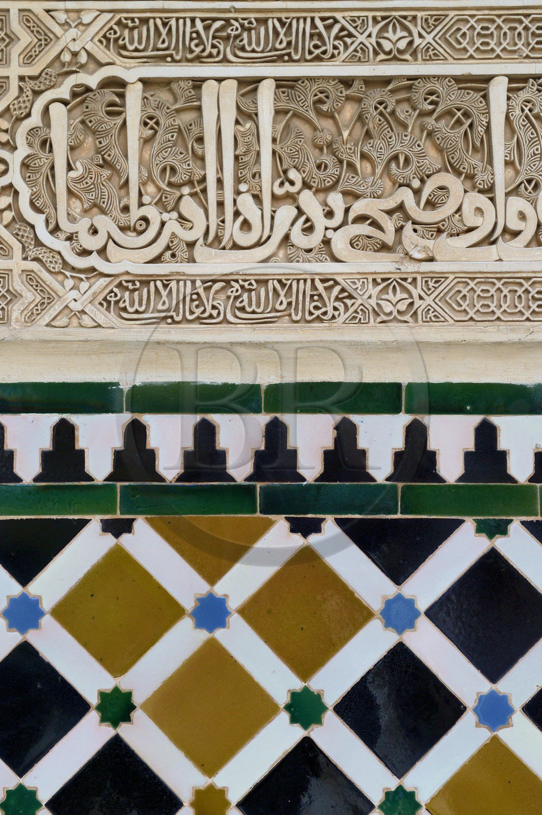 Spain, Andalusia, Granada, Alhambra Nasrid Palace, listed as World Heritage by UNESCO, Comares Palace, inscription from a poem by Ibn Zamrak in honour of Mohammed V after Algeciras was conquered in 1368 on the top of the skirting board in the northern gallery of the Court of the Myrtles (Patio de los Arrayanes)