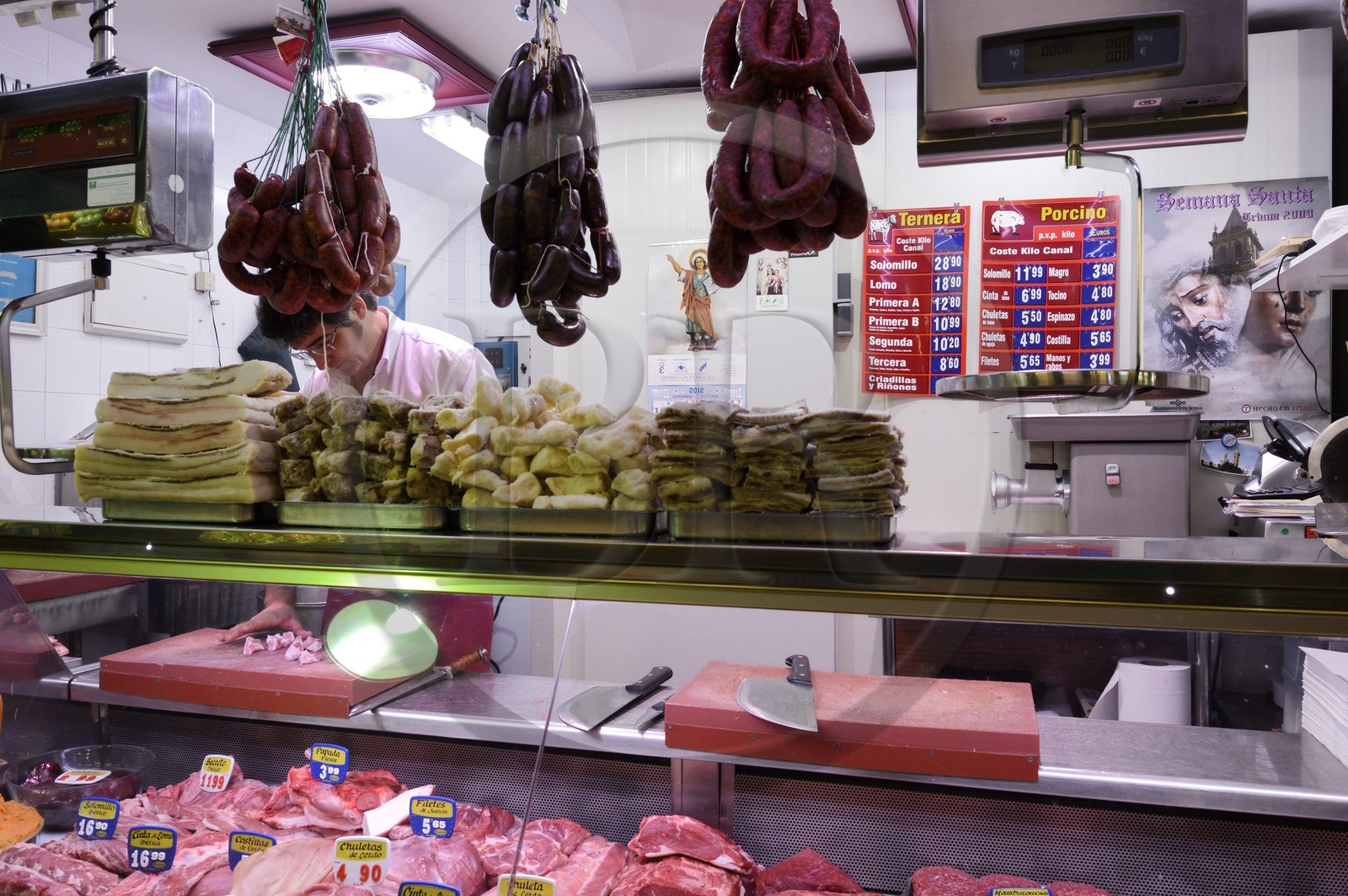 Spain, Andalusia, Seville, Triana district, Triana covered market, butcher's stall