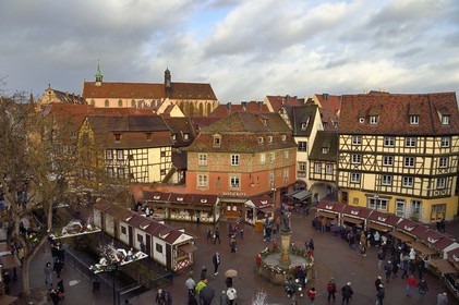 France, Haut Rhin, Colmar, the Christmas Market  between the Lauch river and the Schwendi fountain work by Bartholdi on place de l'Ancienne Douane (Koifhus)
