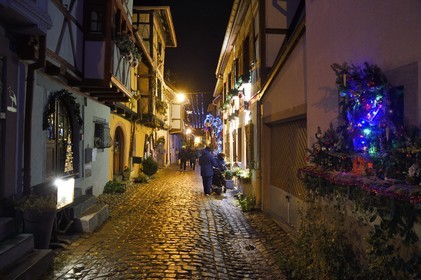 France, Haut Rhin, Eguisheim, labelized Les Plus Beaux Villages de France (the Most Beautiful Villages of France), Ruelle des Remparts, Christmas lights and decorations