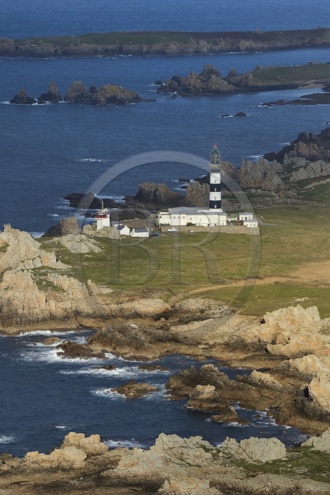 France, Finistere, the regional natural park of Armorica, Iroise sea, Ouessant island, Biosphere reserve (UNESCO), Creach Lighthouse and the West coast (aerial view)