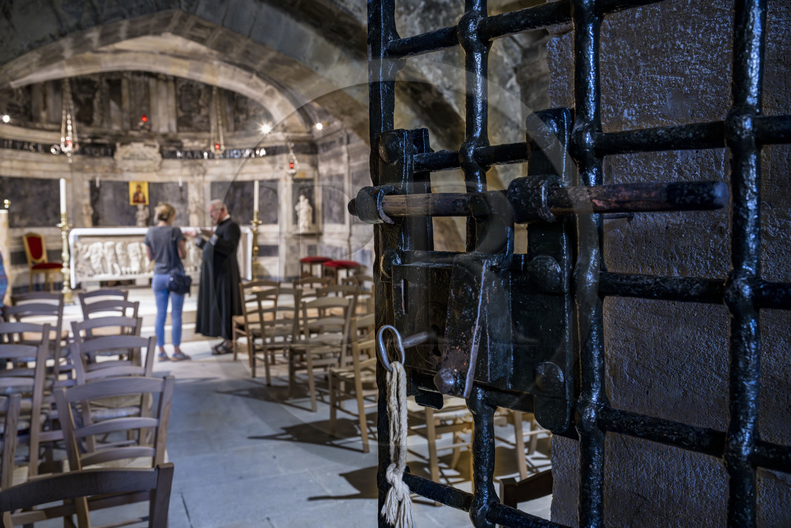 France, Bouches du Rhone, Tarascon, the royal collegiate church of Sainte-Marthe built in the 11th and 12th centuries, historic grid lock dating from 1450 of the crypt remodeled in the 17th century, houses the ancient sarcophagus (from the beginning of the 4th century) which contains the relics of Saint Martha